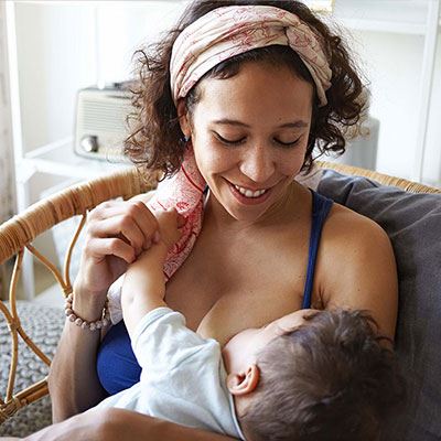 woman breastfeeding her baby