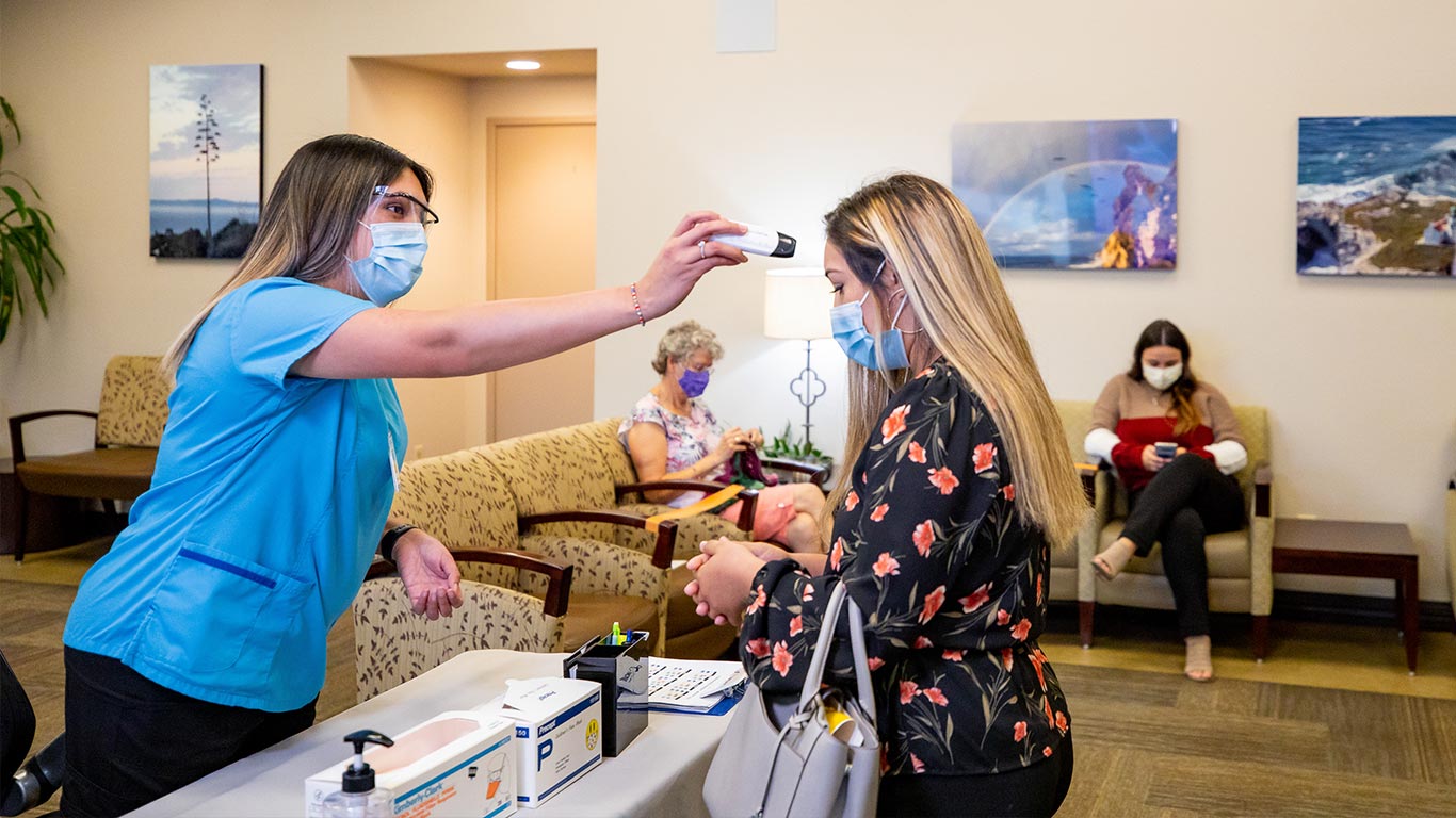 Girl Getting Temperature Taken