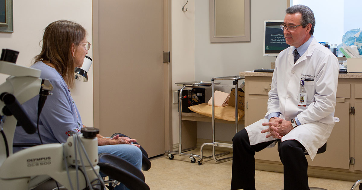 Dr. Kaplan speaking with Alana in an exam room