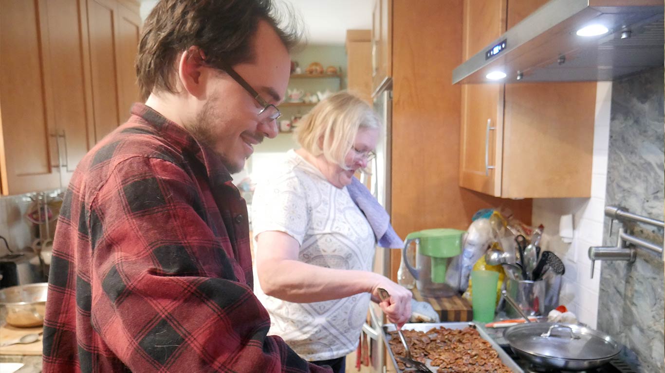 man and woman cooking